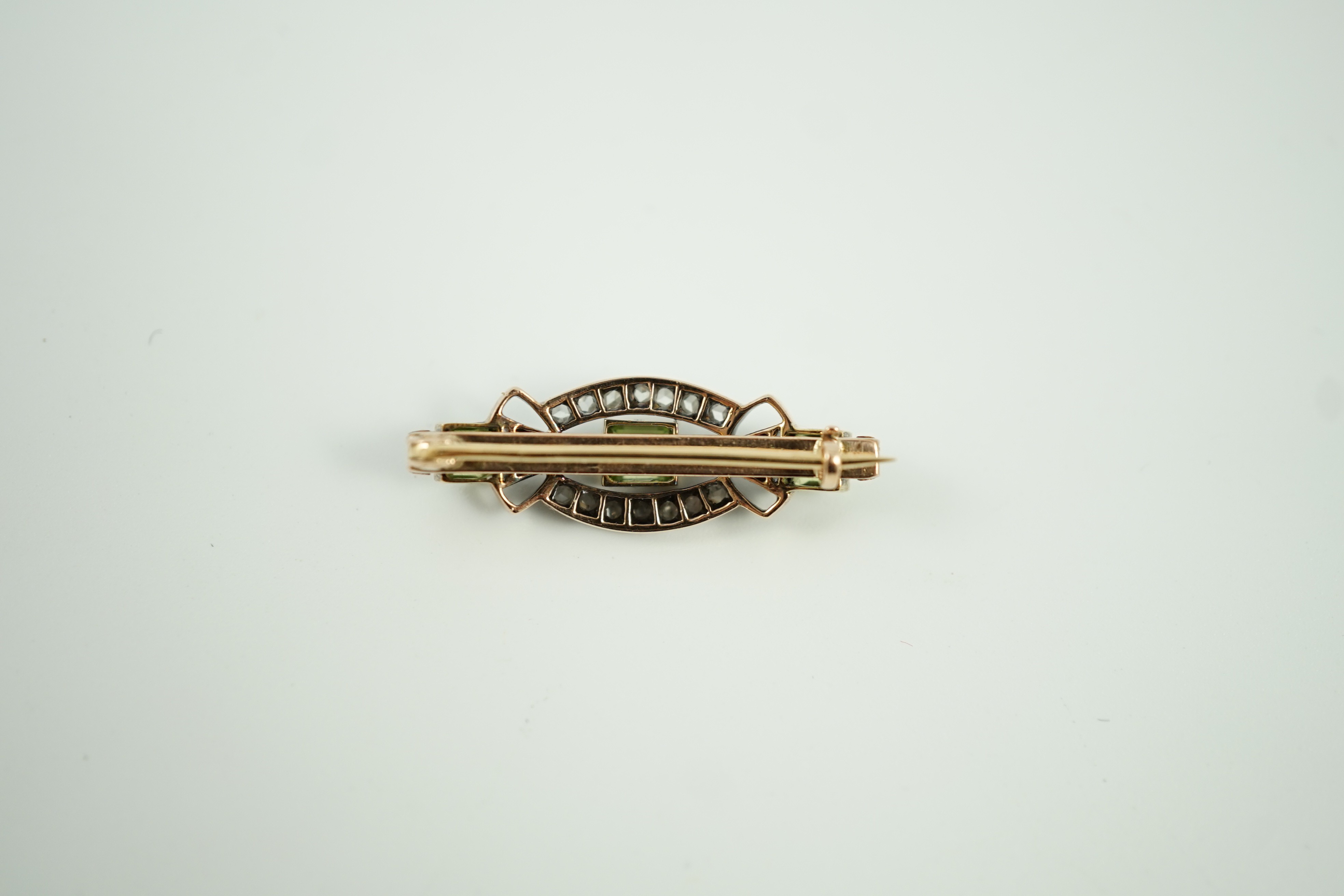 A late Victorian yellow metal, peridot and rose cut diamond set brooch, 31mm, gross weight 4.9 grams.